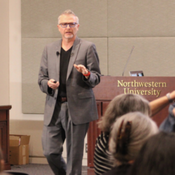 Photo of C. Edward Watson delivering a keynote address at Northwestern University.