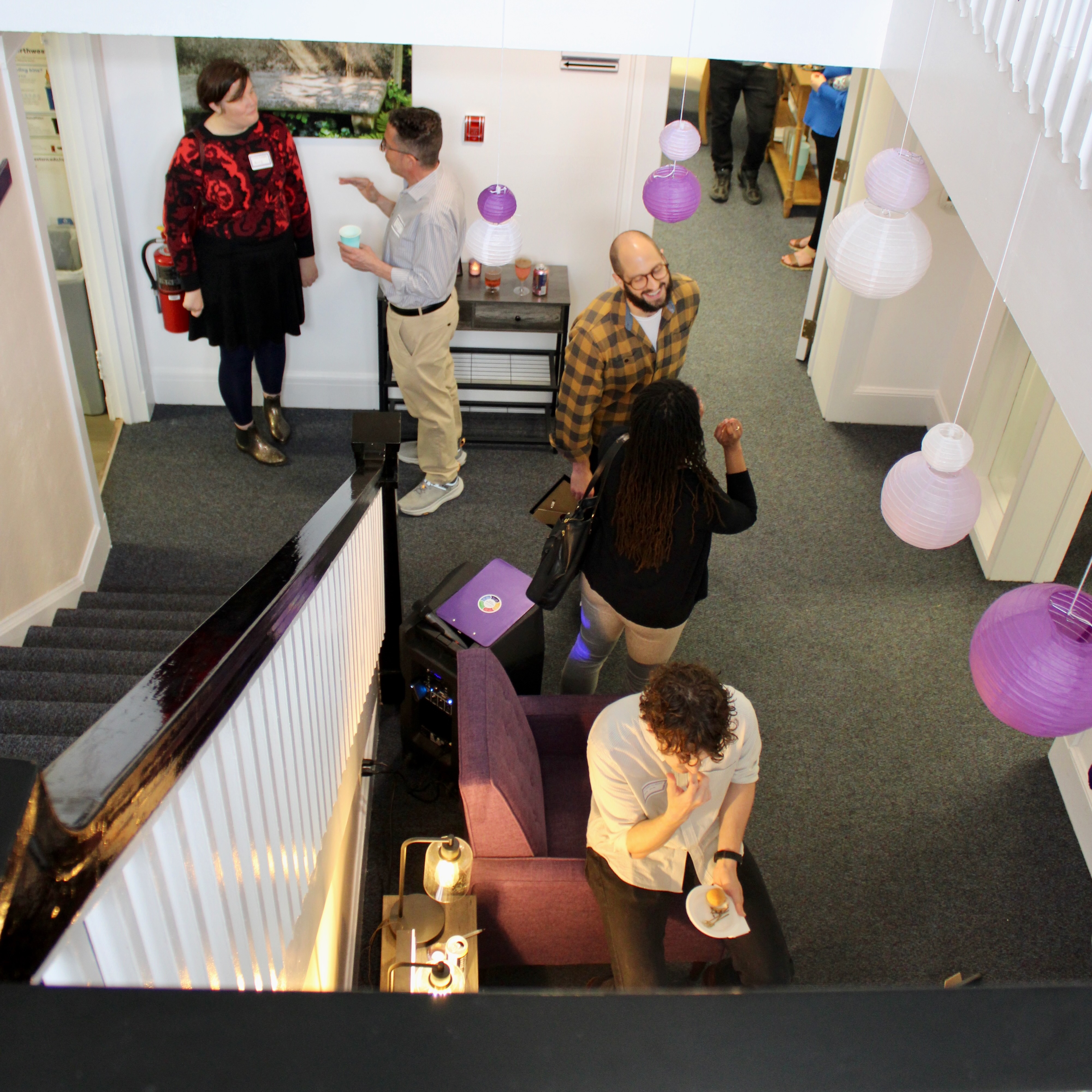 Photo of the Searle Center lobby featuring campus members enjoying a party.