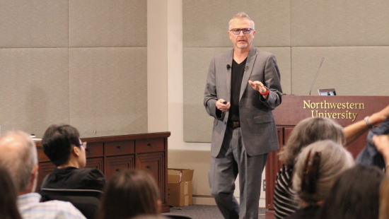 Photograph of C. Edward Watson speaking before an audience at Northwestern University.