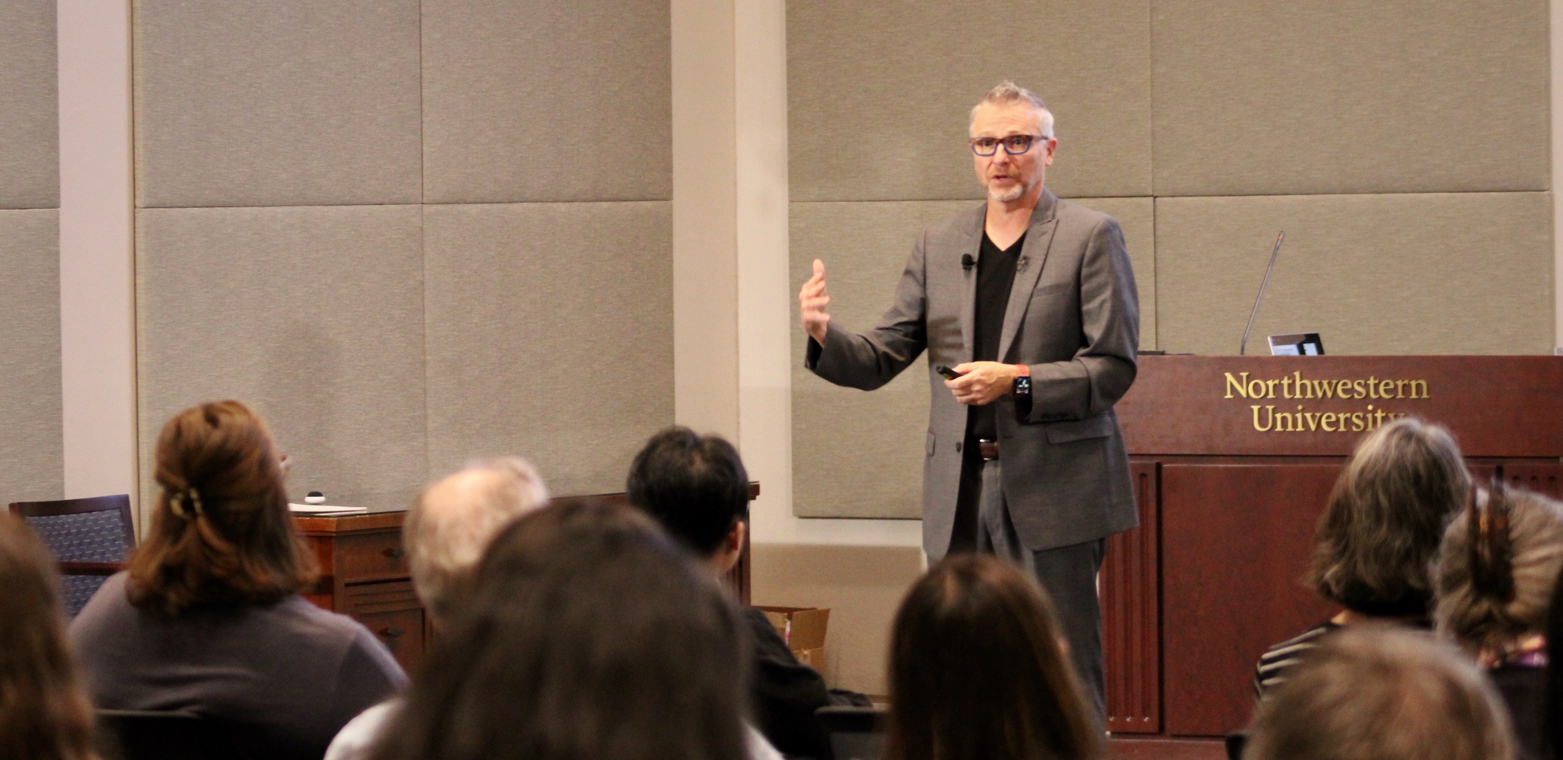 Photo of C. Edward Watson giving a presentation at Northwestern University to a large audience.